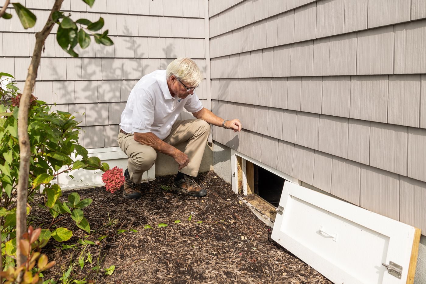 Property manager checking the exterior of a townhome