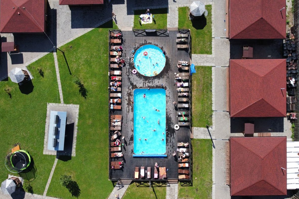 Aerial view of a community pool surrounded by homes